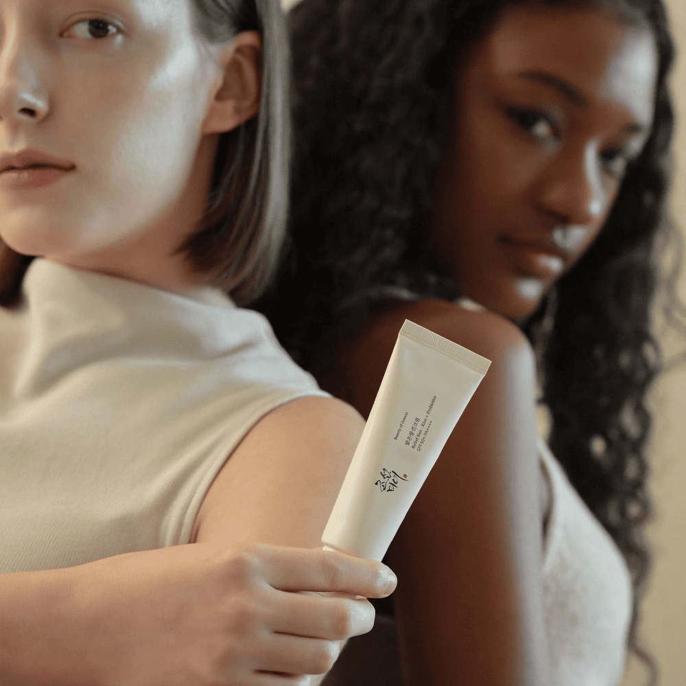 Ferozia customers showcasing Korean skincare with a focus on inclusivity, featuring two women holding a Korean skincare product, highlighting its universal appeal and effectiveness for all skin types.