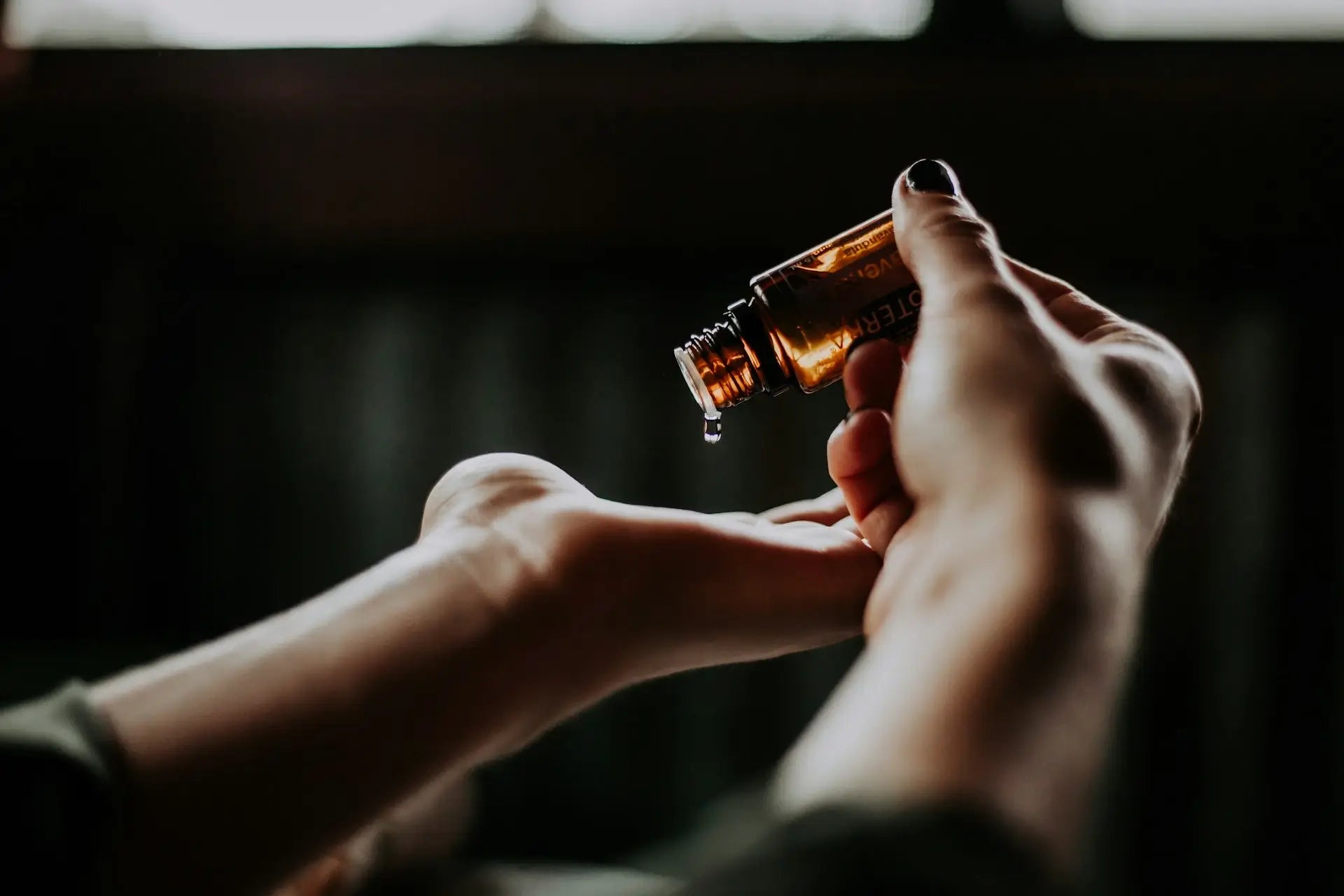 Ferozia Korean skincare essential oil being applied to hand.